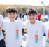 Four boys wearing Building Tomorrows 5K t-shirts at the South Mountain Recreation Complex Reservoir.