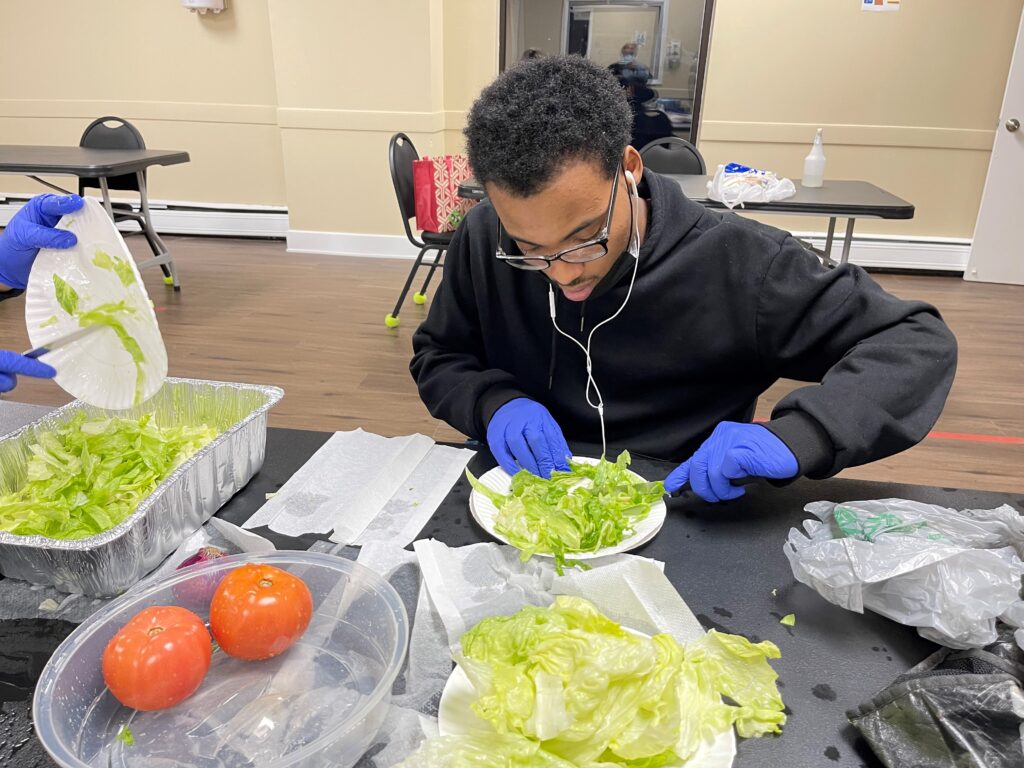CBS participant preparing a salad