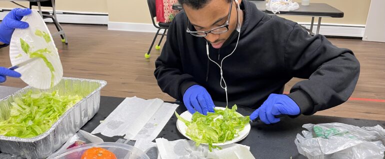 CBS participant preparing a salad
