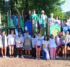 A large group of Camp Hope staffers on the Camp Hope playground on a sunny morning in 2024.