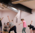 A group of adults participating in a yoga class.