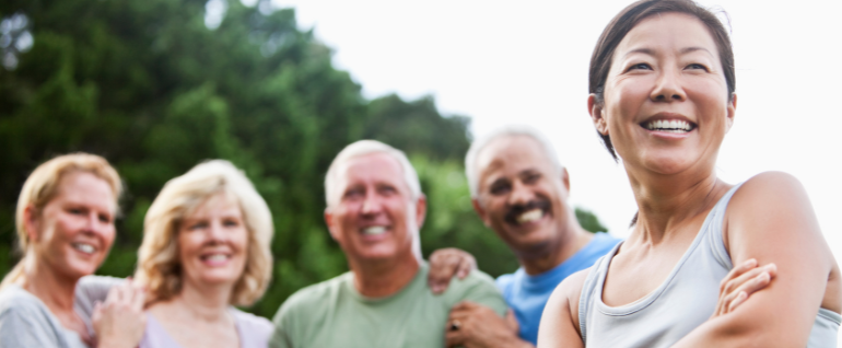 A group of adults smiling.
