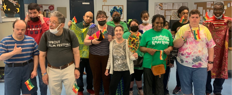 A group of people holding Ghana flags
