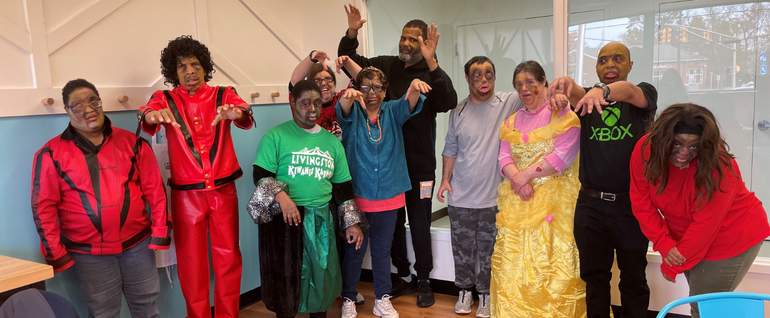 Ten people dressed and in zombie makeup for a performance of the Michael Jackson song 