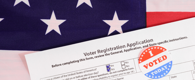 American flag backdrop with voter registration form and "I voted today" sticker