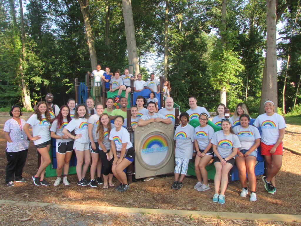 Camp Hope staff group photo on playground